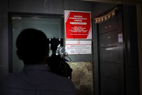 A cameraman takes visuals outside the office of Maiden Pharmaceuticals Ltd. company, in New Delhi, India, October 6, 2022.