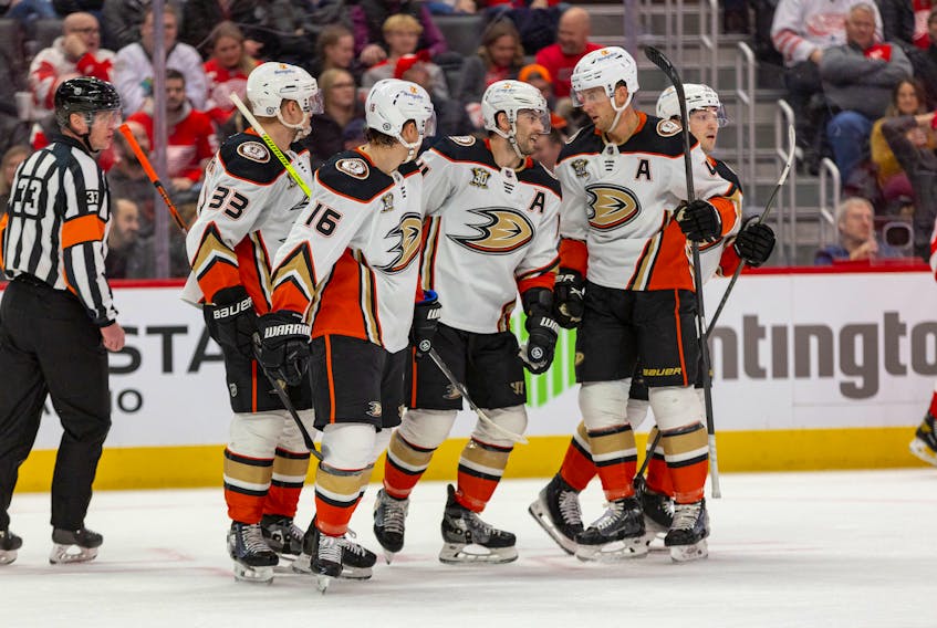 Dec 18, 2023; Detroit, Michigan, USA; The Anaheim Ducks celebrate a goal by center Adam Henrique (14) during the first period against the Detroit Red Wings at Little Caesars Arena. Mandatory Credit: Brian Bradshaw Sevald-USA TODAY Sports/File Photo