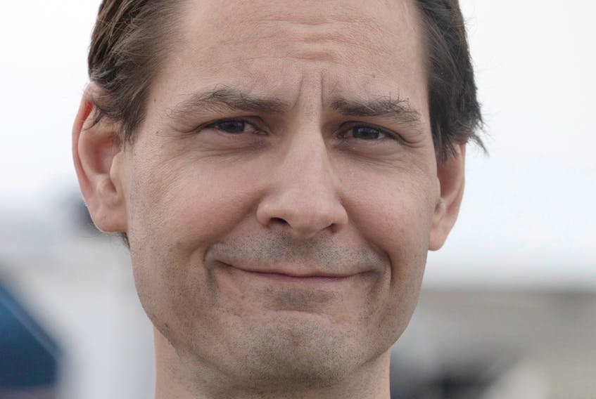 Former diplomat Michael Kovrig reacts following his arrival on a Canadian air force jet after his release from detention in China, at Pearson International Airport in Toronto, Ontario, Canada September 25, 2021.