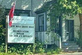 P.E.I.’s municipal minister has issued an ultimatum to Murray Harbour Councillor John Robertson: comply with sanctions from the town over a controversial sign he put on his lawn or step down.