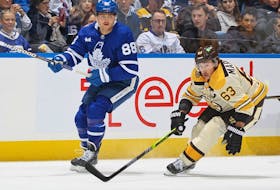 Bruins forward Brad Marchand, right, skates against Maple Leafs forward William Nylander during NHL action at Scotiabank Arena in Toronto, Saturday, Dec. 2, 2023.