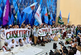Climate activists protest in support of Palestinians in Gaza, at the United Nations Climate Change Conference (COP28) in Dubai, United Arab Emirates, December 3, 2023.