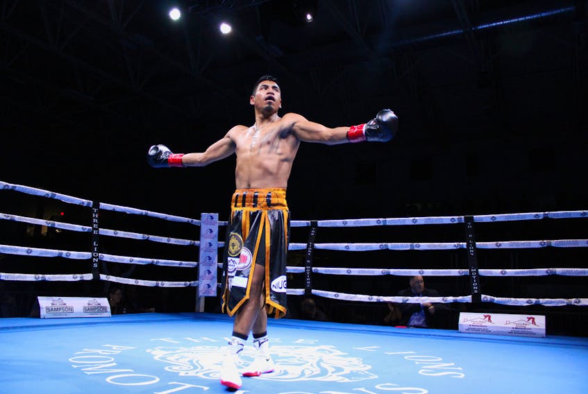 Pedro Bernal celebrates after winning his men's junior lightweight division bout over Mario Victorino Vera on Saturday in North Sydney. Bernal knocked out Vera for the victory. LUKE DYMENT/CAPE BRETON POST