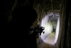 An Israeli soldier secures a tunnel underneath Al Shifa Hospital in Gaza City, amid the ongoing ground operation of the Israeli army against Palestinian Islamist group Hamas, in the northern Gaza Strip, November 22, 2023.