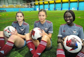Newfoundland and Labrador Soccer Association (NLSA) players and 2025 Canada Summer Games Team NL soccer team members (from left) Jorja Row, Gina Power and Athiei Achiek, all 15 years old, shown at the TechPlex in St. John's before team practice on Nov. 30. The trio are in Mississauga, Ont. on this week for Under16/17 National Development Competition (NDC) with Soccer Canada taking place next week. -Photo by Joe Gibbons/The Telegram