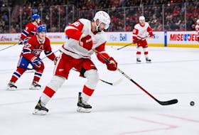Dec 2, 2023; Montreal, Quebec, CAN; Detroit Red Wings defenseman Jake Walman (96) plays the puck against the Montreal Canadiens during the third period at Bell Centre. Mandatory Credit: David Kirouac-USA TODAY Sports