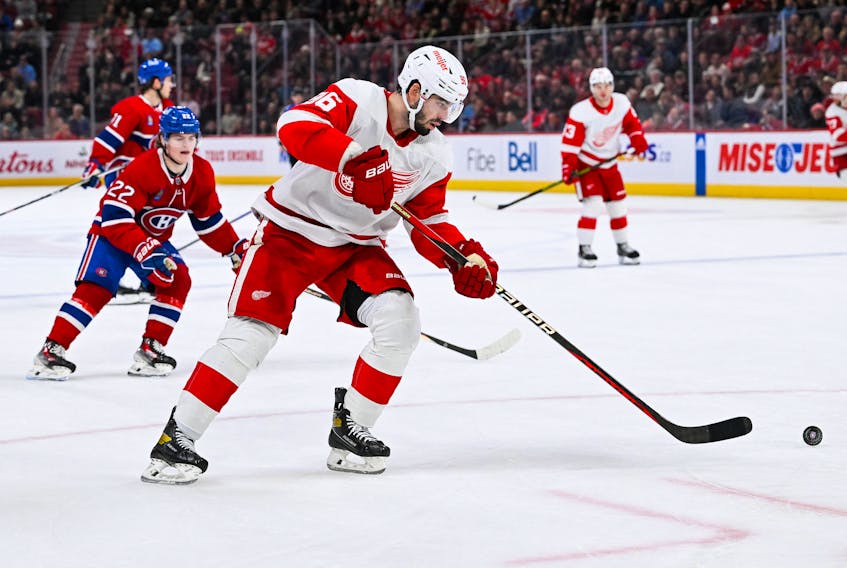Dec 2, 2023; Montreal, Quebec, CAN; Detroit Red Wings defenseman Jake Walman (96) plays the puck against the Montreal Canadiens during the third period at Bell Centre. Mandatory Credit: David Kirouac-USA TODAY Sports