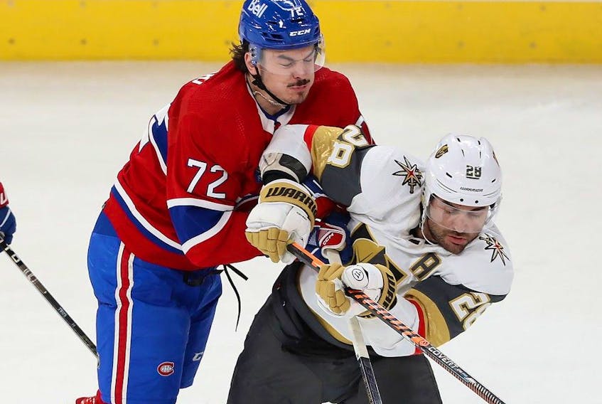 Canadiens' Arber Xhekaj collides at mid-ice with Golden Knights' William Carrier during a game last month at the Bell Centre.
