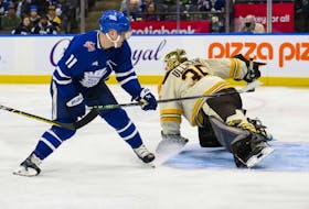 Toronto Maple Leafs centre Max Domi scores on Boston Bruins goaltender Linus Ullmark.