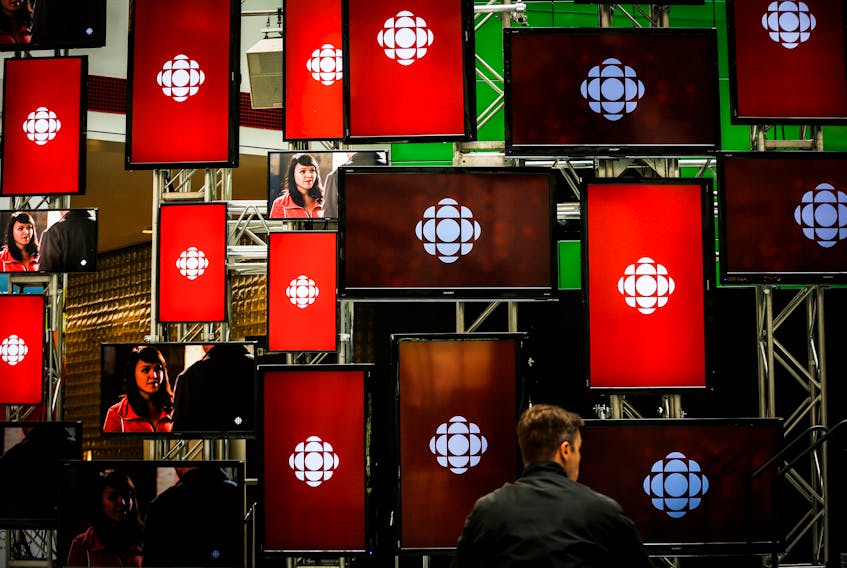 A man sits inside the Canadian Broadcast Corporation (CBC) broadcasting centre in Toronto May 23, 2014.