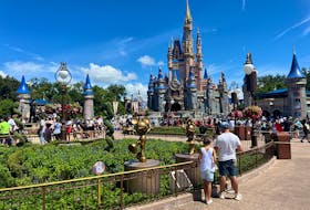 People gather ahead of the "Festival of Fantasy" parade at the Walt Disney World Magic Kingdom theme park in Orlando, Florida, U.S. July 30, 2022. 