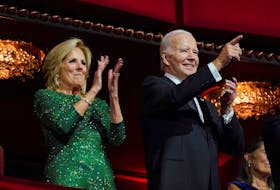 U.S. President Joe Biden points a finger and first lady Jill Biden applauds as they attend the 46th Kennedy Center Honors gala, at the Kennedy Center in Washington, U.S. December 3, 2023.