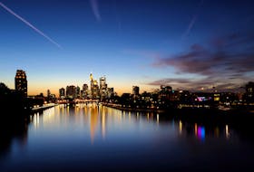 The sun sets behind the skyline during a warm autumn evening in Frankfurt, Germany, October 1, 2023. 