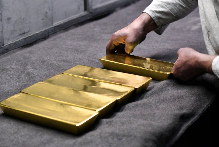 An employee places ingots of 99.99 percent pure gold in a workroom at the Novosibirsk precious metals refining and manufacturing plant in the Siberian city of Novosibirsk, Russia, September 15, 2023.