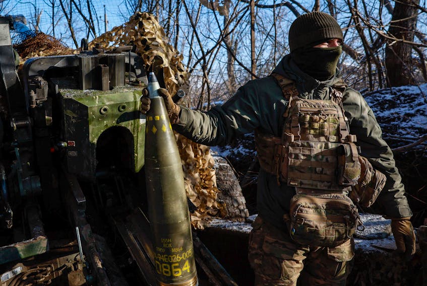 A serviceman of the 12th Special Forces Brigade Azov of the National Guard of Ukraine holds a shell before firing from a howitzer LH-70 towards Russian troops at a position near a frontline, amid Russia's attack on Ukraine, at an undisclosed location in Donetsk region, Ukraine, November 22, 2023. REUTERS/Alina Smutko     A serviceman of the 12th Special Forces Brigade Azov of the National Guard of Ukraine holds a shell before firing from a howitzer LH-70 towards Russian troops at a position near a frontline, amid Russia's attack on Ukraine, at an undisclosed location in Donetsk region, Ukraine, November 22, 2023. REUTERS/Alina Smutko