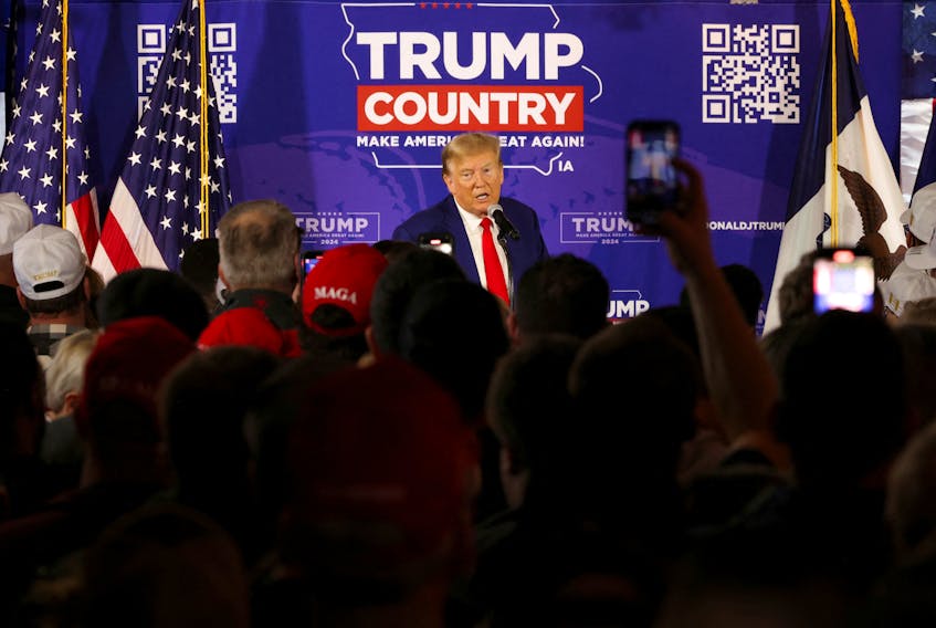 Former U.S. President and Republican presidential candidate Donald Trump rallies with supporters at a "commit to caucus" event at a Whiskey bar in Ankeny, Iowa, U.S. December 2, 2023.