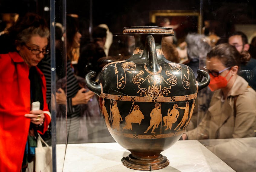 People look at the 'Meidias hydria', an Ancient Greek vase from 420 BC ,on loan from the British museum for the temporary exhibition titled Meanings' at the Acropolis Museum in Athens, Greece, December 5, 2023.  The 'Meidias hydria' leaves London for the first time in 250 years.