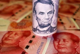 U.S. Dollar and Chinese Yuan banknotes are seen in this illustration picture taken June 14, 2022.
