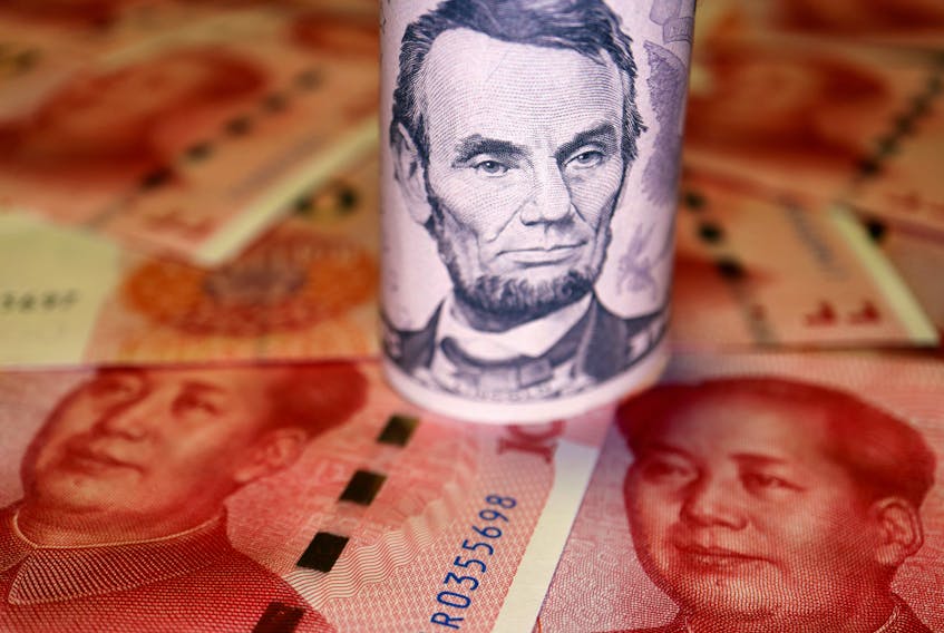 U.S. Dollar and Chinese Yuan banknotes are seen in this illustration picture taken June 14, 2022.