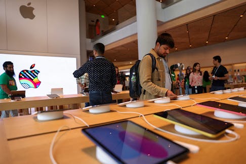 Bloggers and other journalists attend a media preview inside India's first Apple retail store, a day ahead of its launch in Mumbai, India, April 17, 2023.