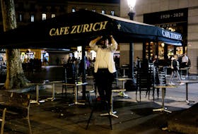 A waiter picks up the terrace of the Zurich bar at Placa de Catalunya in Barcelona, Spain April 4, 2023.