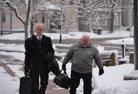 Former P.E.I. Catholic priest Maurice Joseph Praught, right, enters the P.E.I. Supreme Court building in Charlottetown with his lawyer, Gary Demeulenaere, on Dec. 5. Praught, 70, pleaded guilty and was sentenced to five years in prison for four counts of sexual exploitation involving a boy under the age of 18 at the time of the offences in the 1990s. Terrence McEachern • The Guardian