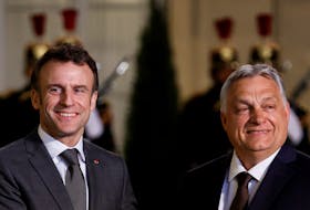 French President Emmanuel Macron welcomes Hungarian Prime Minister Viktor Orban before a meeting at the Elysee Palace in Paris, France March 13, 2023.
