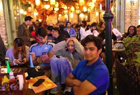Cricket - ICC Cricket World Cup 2023 - Final - Fans gather to watch India v Australia - New Delhi, India - November 19, 2023 A fan reacts as they watch the final in a bar in New Delhi
