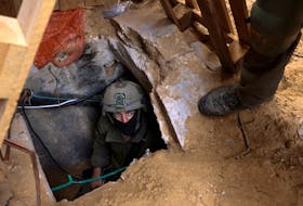 Israeli soldiers operate at the opening to a tunnel at Al Shifa Hospital compound in Gaza City, amid the ongoing ground operation of the Israeli army against Palestinian Islamist group Hamas, in the Gaza Strip, November 22, 2023.