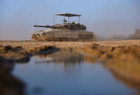 An Israeli tank maneuvers near Israel's border with southern Gaza, amid the ongoing conflict between Israel and the Palestinian Islamist group Hamas, in Israel, December 4, 2023.