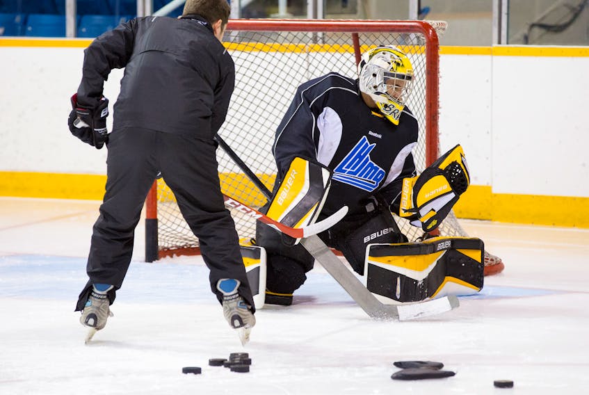 Former Cape Breton Eagle goalie coach Joel Gauthier works with Francois Brassard during team practice at Centre 200 in Sydney. Brassard is the only Eagles goaltender to ever score a goal. CAPE BRETON POST FILE PHOTO.