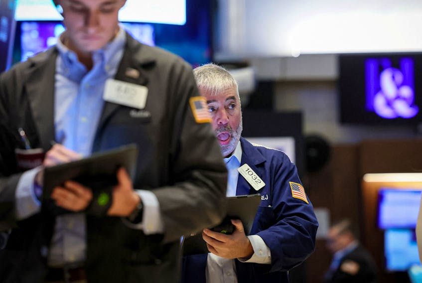 Traders work on the floor of the New York Stock Exchange (NYSE) in New York City, U.S., September 26, 2023. 