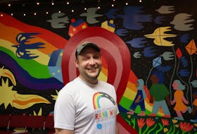 Scott Alan, men’s sexual health co-ordinator with PEERS Alliance, stands in front of the mural they had painted in time for World AIDS Day. - Logan MacLean