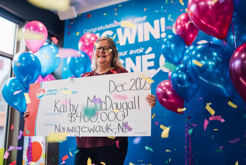 Kathy MacDougall of Nauwigewauk, N.B. won $400,000 Mega 360 prize at the head office of Atlantic Lottery on Dec. 1. - Contributed