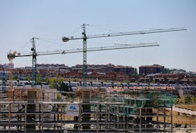 Cranes can be seen at a construction site in north Madrid, Spain, July 18, 2016.