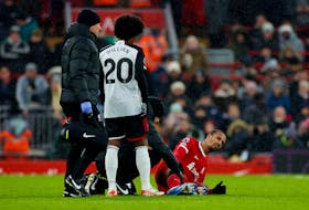 Soccer Football - Premier League - Liverpool v Fulham - Anfield, Liverpool, Britain - December 3, 2023 Liverpool's Joel Matip receives medical attention after sustaining an injury