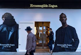 Plywood covers the windows of an Ermenegildo Zegna store in Chicago, Illinois, U.S. October 13, 2020.