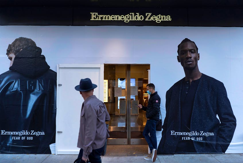 Plywood covers the windows of an Ermenegildo Zegna store in Chicago, Illinois, U.S. October 13, 2020.