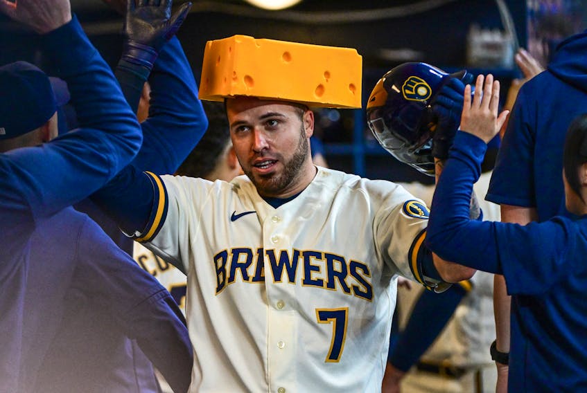 Apr 26, 2023; Milwaukee, Wisconsin, USA; Milwaukee Brewers catcher Victor Caratini (7) is greeted in the dugout after hitting a two-run home run in the third inning against the Detroit Tigers at American Family Field. Mandatory Credit: Benny Sieu-USA TODAY Sports/File Photo