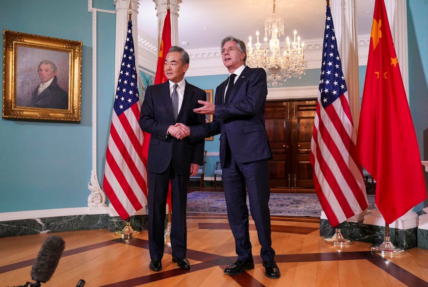 U.S. Secretary of State Antony Blinken shakes hands with Chinese Foreign Minister Wang Yi as they meet at the State Department in Washington, U.S., October 26, 2023.