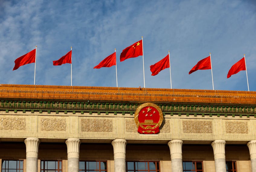 A Chinese flag flutters on top of the Great Hall of the People ahead of the opening ceremony of the Belt and Road Forum (BRF), to mark 10th anniversary of the Belt and Road Initiative, in Beijing, China October 18, 2023.