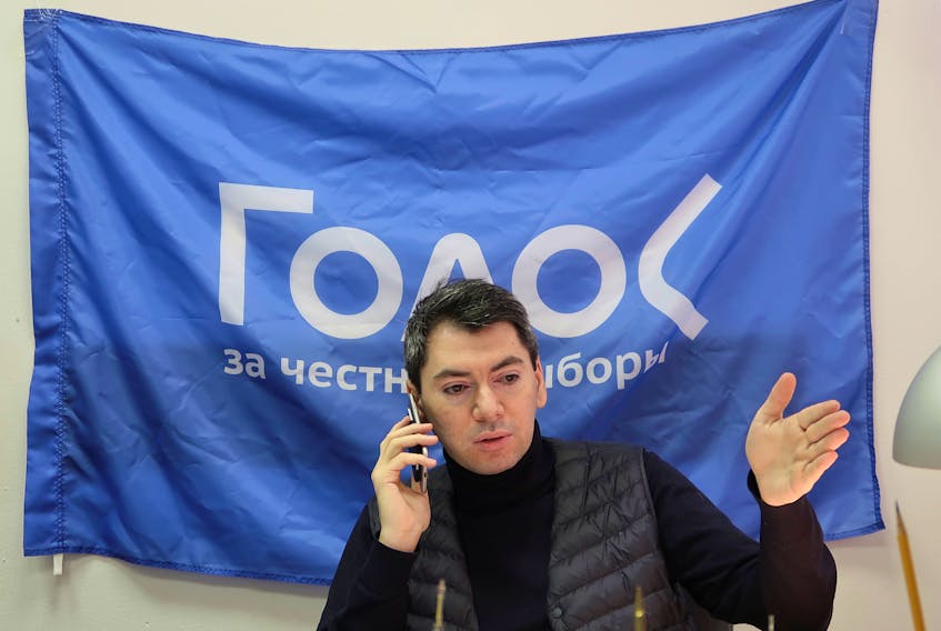 Co-chairman of Golos non-governmental organisation Grigory Melkonyants speaks on the phone at his office in Moscow, Russia March 13, 2018. Picture taken March 13, 2018.