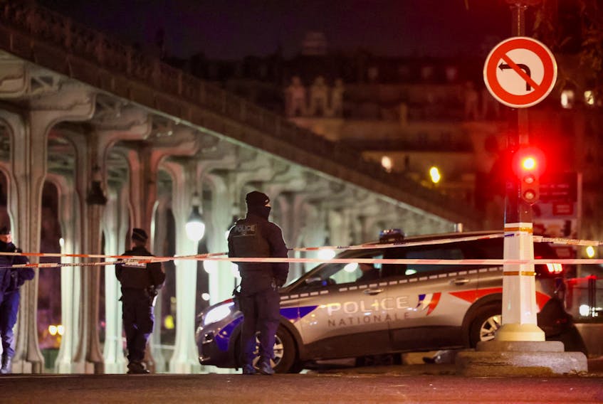 French police secures the access to the Bir-Hakeim bridge after a security incident in Paris, France December 3, 2023.