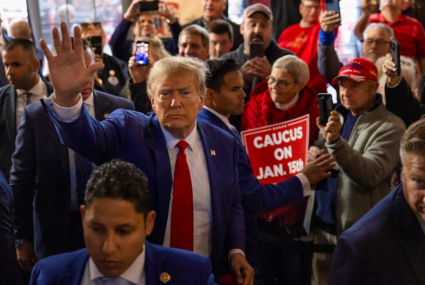 Former U.S. President and Republican presidential candidate Donald Trump rallies with supporters at a "commit to caucus" event at a Whiskey bar in Ankeny, Iowa, U.S. December 2, 2023.