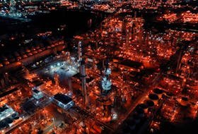 A nighttime view of Marathon Petroleum's Los Angeles Refinery, which processes domestic & imported crude oil into gasoline, diesel fuel, and other refined petroleum products, in Carson, California, U.S., March 11, 2022. Picture taken with a drone.