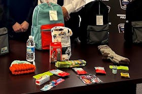 Backpacks put together by the Woodstock Police Force with donations from local groups and businesses contain cold-weather gear, personal grooming items, protein bars, and water.