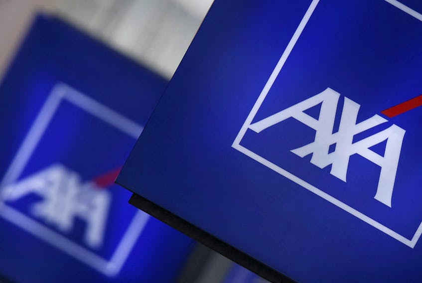 Signs displaying the logo of French insurer AXA on a building in Nanterre, near Paris, March 8, 2016.