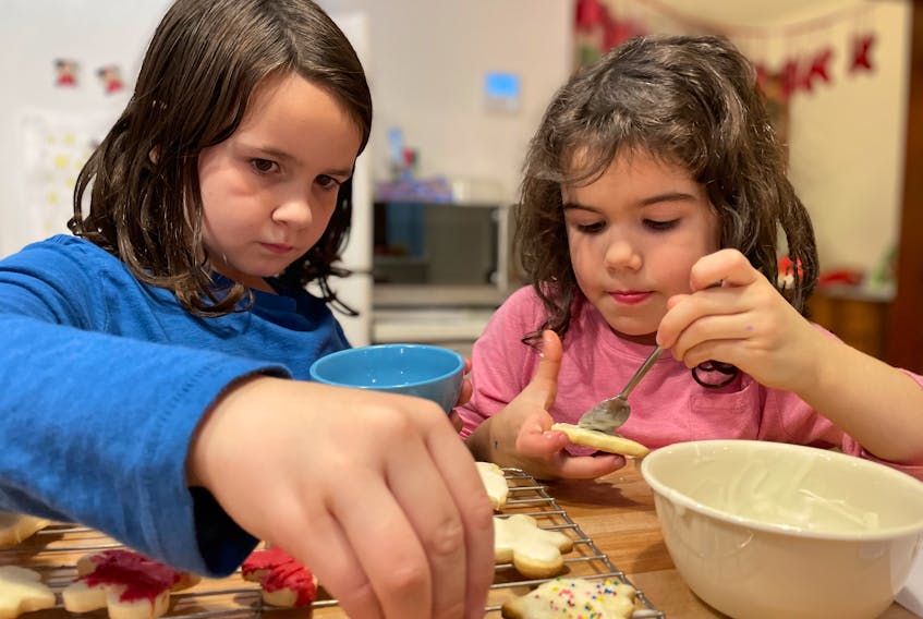 Emilie Chiasson's nieces Sylvie and Leni help make shortbreads.  They are huge fans of all the sweet things their grandmother makes. - Emilie Chiasson
