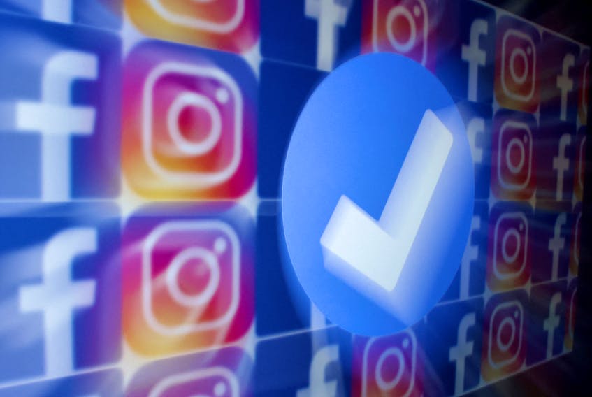A blue verification badge and the logos of Facebook and Instagram are seen in this picture illustration taken January 19, 2023.