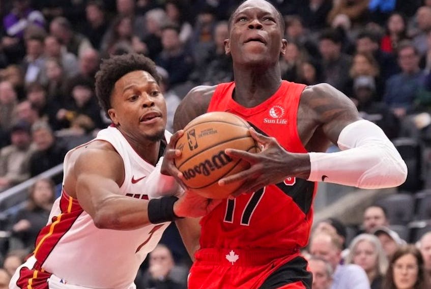 Raptors' Dennis Schroder looks to shoot on the Heat's Kyle Lowry on Wednesday.